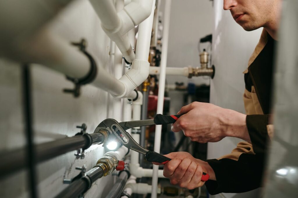 Plumbers maintaining commercial plumbing pipes in Louisville